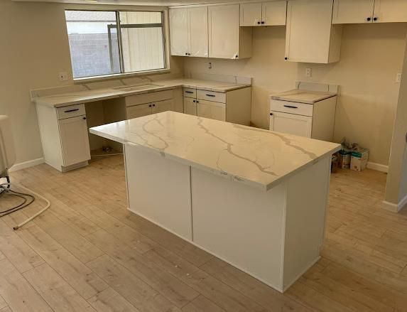 Calacatta quartz kitchen white cabinets World Stone Charlotte