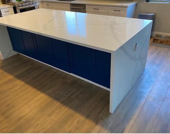 Calacatta quartz waterfall edge by World Stone Fabricators Charlotte