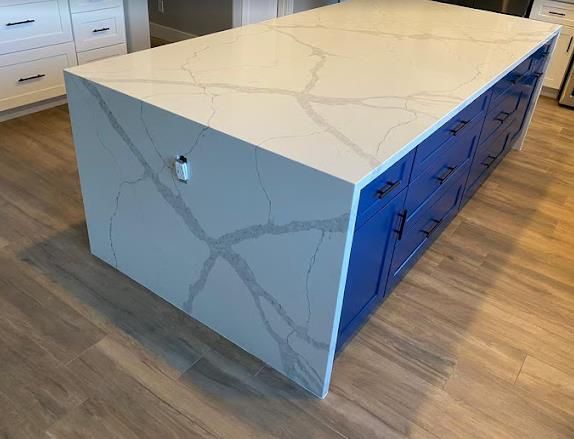 Calacatta quartz waterfall island installed by World Stone Fabricators Charlotte